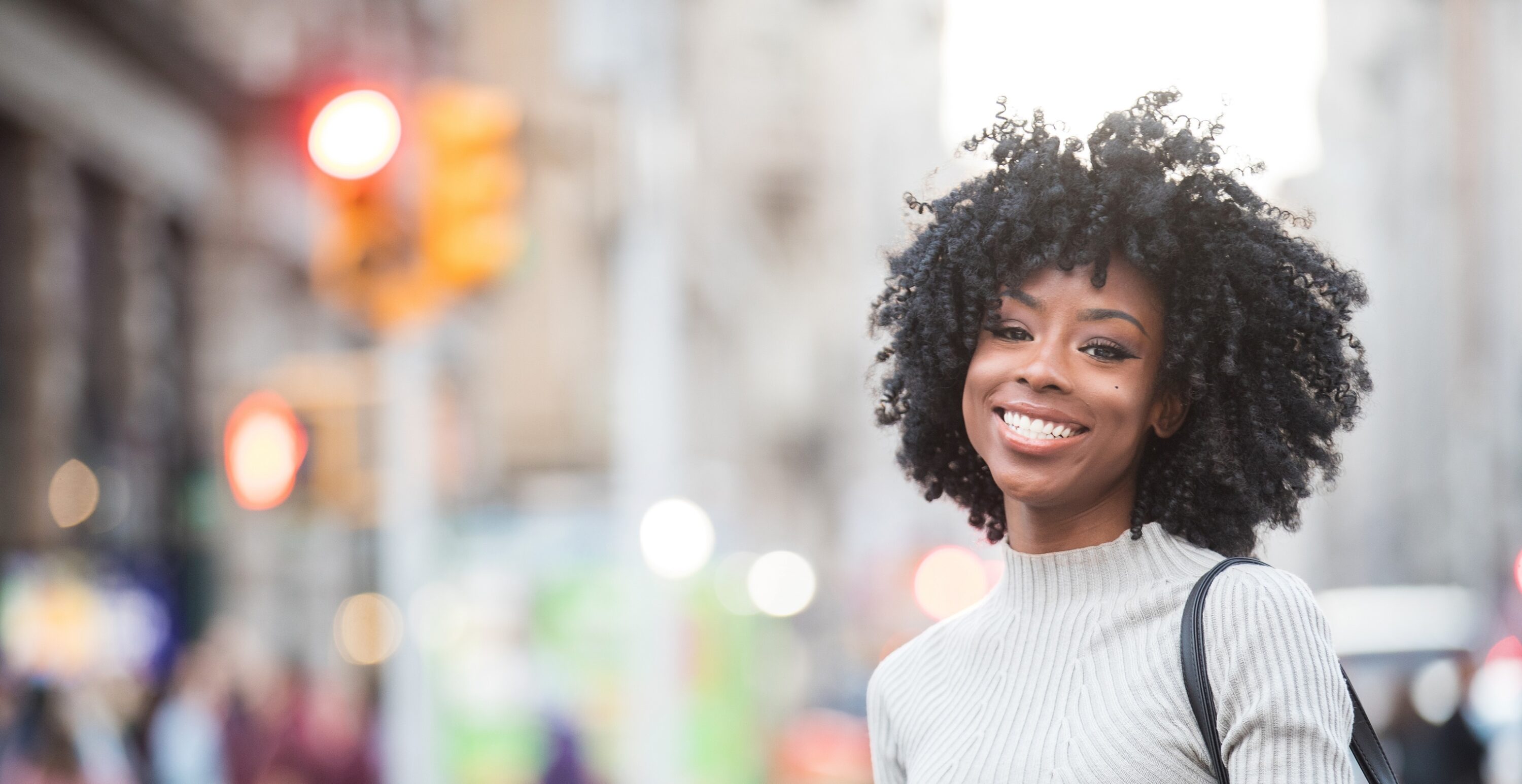 Happy woman on a city street